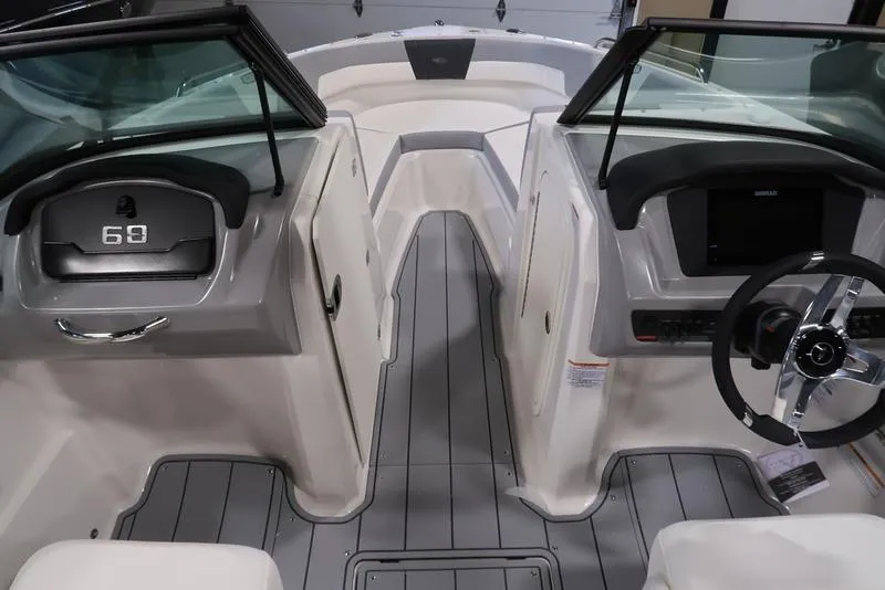 Slide: The Image of 2025 Chaparral 23 SSi boat interior with sleek design and modern dashboard. - 2