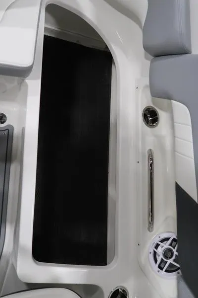 Slide: The Image of Interior view of 2025 Chaparral 23 SSi boat, featuring sleek seating and speaker system. - 20