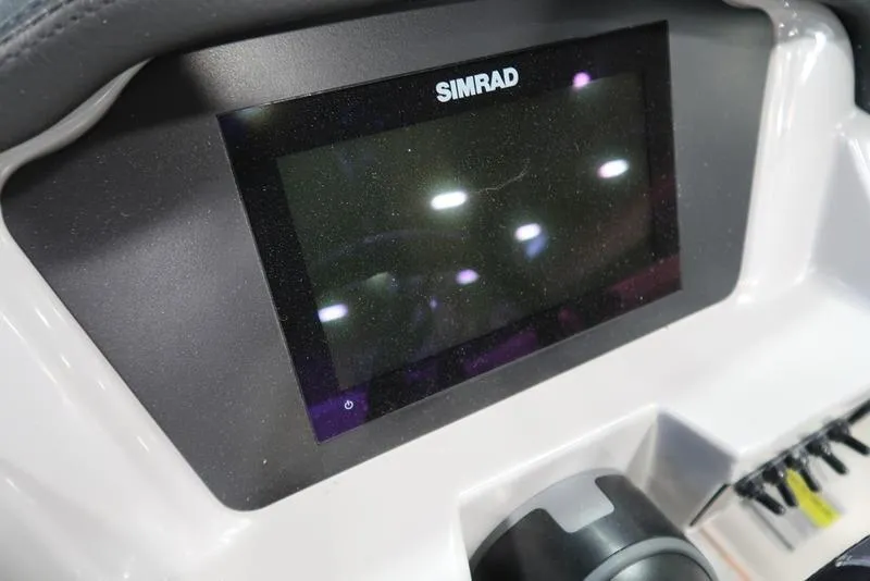 Slide: The Image of Simrad display on 2025 Chaparral 23 SSi boat dashboard. - 24