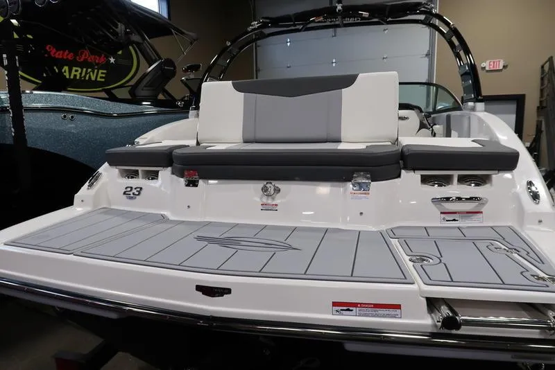 Slide: The Image of 2025 Chaparral 23 SSi boat with sleek design and spacious seating. - 7