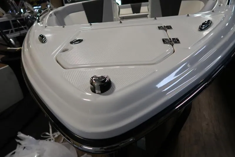 Slide: The Image of 2025 Chaparral 23 SSi boat bow with sleek design and chrome fittings. - 9