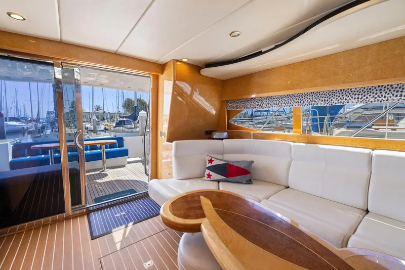 Slide: The Image of Luxurious 2008 Dyna 51 yacht interior with white seating and wooden accents. - 25