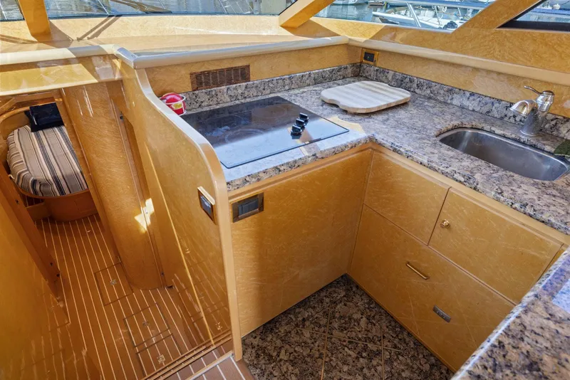 Slide: The Image of Luxurious 2008 Dyna 51 yacht kitchen with granite countertops and modern amenities. - 27