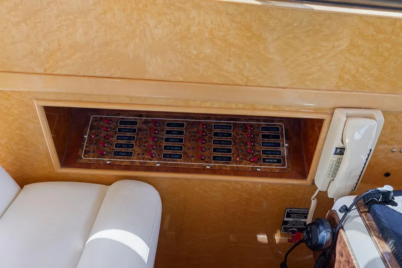 Slide: The Image of Control panel and phone on a 2008 Dyna 51 yacht interior. - 29