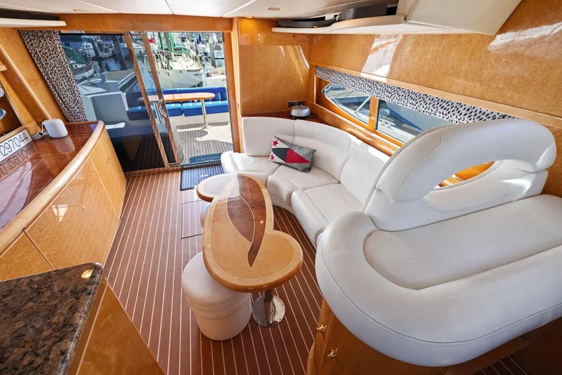 Slide: The Image of Luxurious 2008 Dyna 51 yacht interior with elegant seating and wooden accents. - 30
