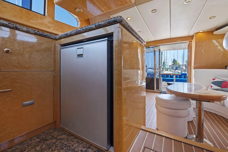 Slide: The Image of Luxurious 2008 Dyna 51 yacht interior with modern kitchen and dining area. - 36