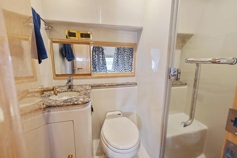 Slide: The Image of Luxurious bathroom in 2008 Dyna 51 yacht with granite countertop and shower. - 40