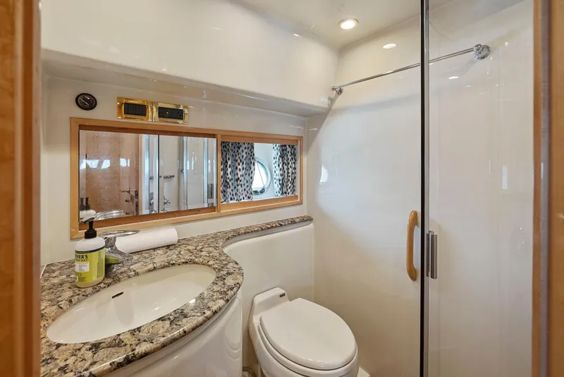 Slide: The Image of Luxurious bathroom in 2008 Dyna 51 yacht with granite countertop and glass shower. - 44
