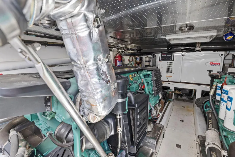 Slide: The Image of Engine room of a 2008 Dyna 51 yacht, featuring mechanical components and equipment. - 47