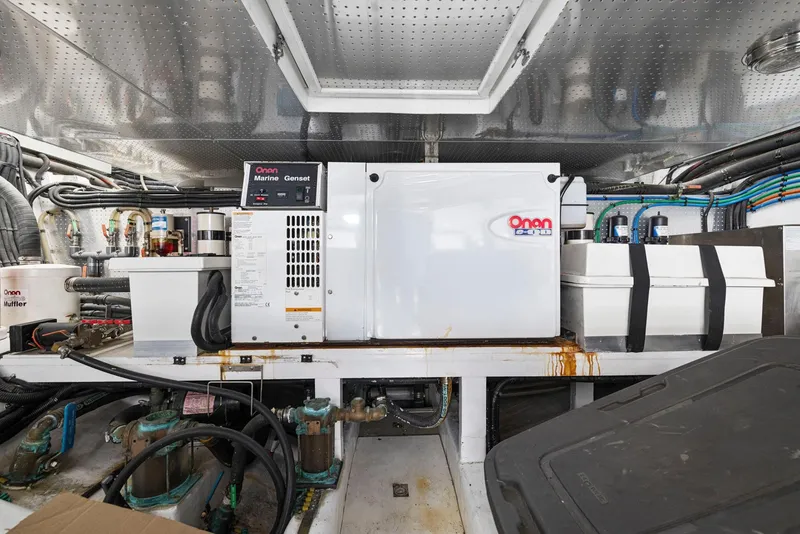 Slide: The Image of Engine room of a 2008 Dyna 51 yacht with Onan generator and equipment. - 48