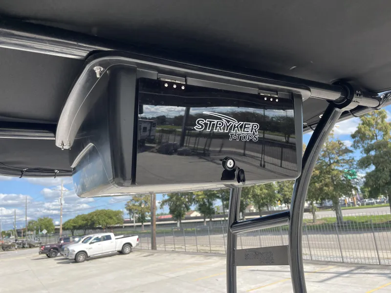 Slide: The Image of 2005 Sea Pro SV2100 with Stryker T-Top, parked outdoors under clear sky. - 14