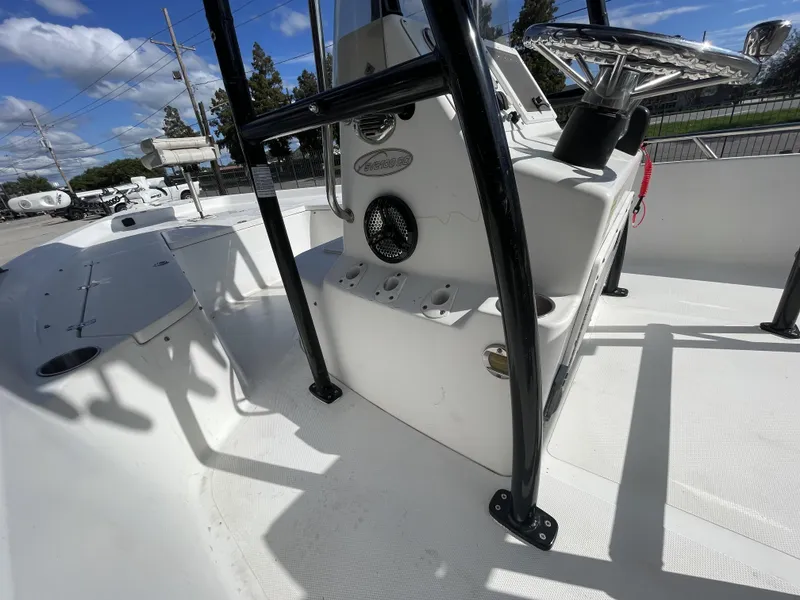 Slide: The Image of 2005 Sea Pro SV2100 boat interior with steering console and seating area. - 19