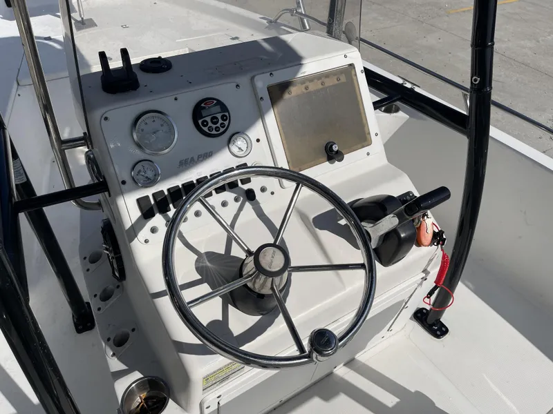 Slide: The Image of 2005 Sea Pro SV2100 boat console with steering wheel and gauges. - 8