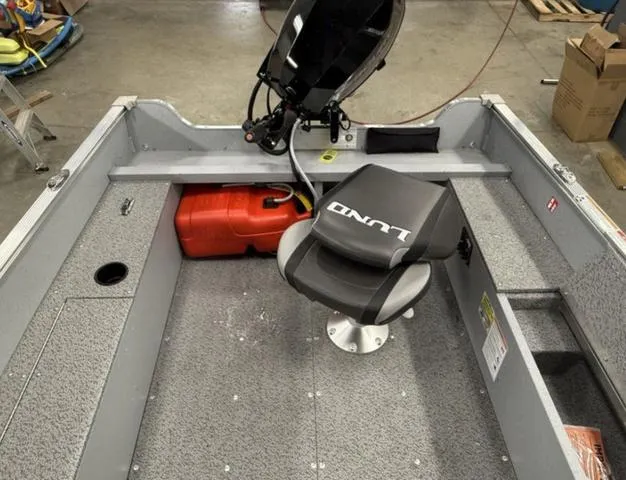 Slide: The Image of 2025 Lund 1600 Fury Tiller boat interior with seat and fuel tank. - 5