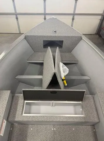 Slide: The Image of 2025 Lund 1600 Fury Tiller boat interior with storage compartments and seating. - 8