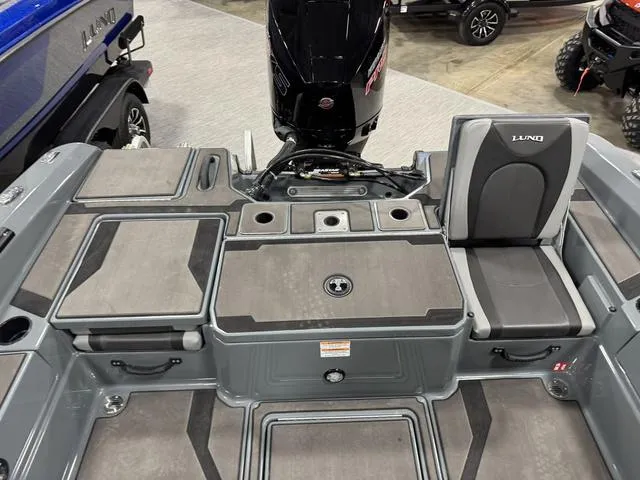 Slide: The Image of 2025 Lund 185 Impact GL Sport boat interior with seating and storage compartments. - 10