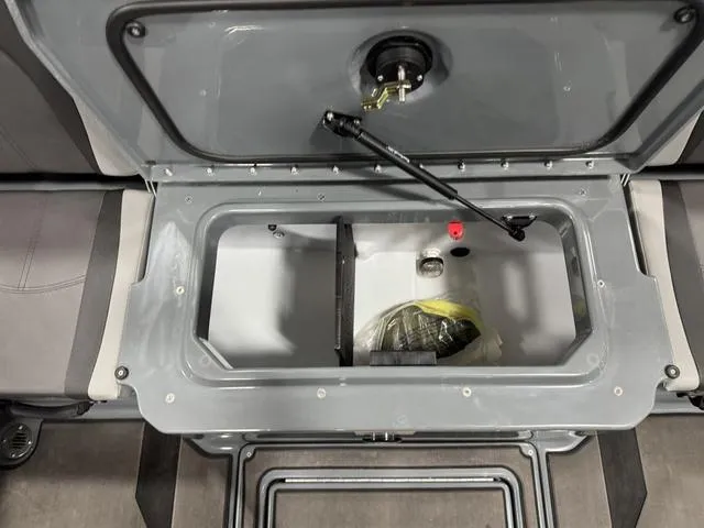 Slide: The Image of Open storage compartment in 2025 Lund 185 Impact GL Sport boat. - 11