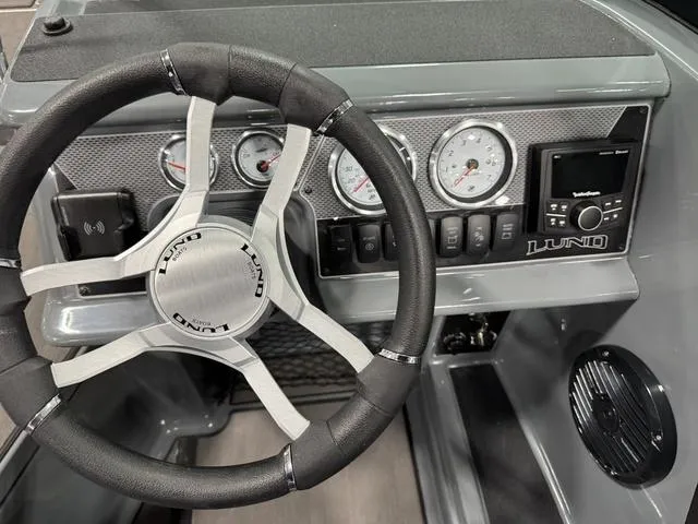 Slide: The Image of Steering wheel and dashboard of 2025 Lund 185 Impact GL Sport boat. - 22
