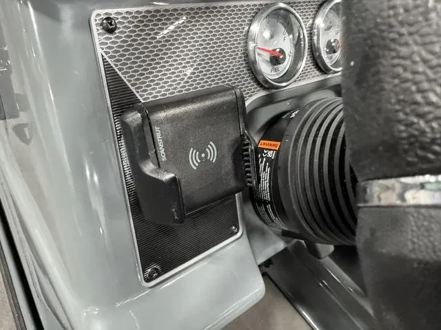 Slide: The Image of Dashboard of 2025 Lund 185 Impact GL Sport with gauges and phone holder. - 23