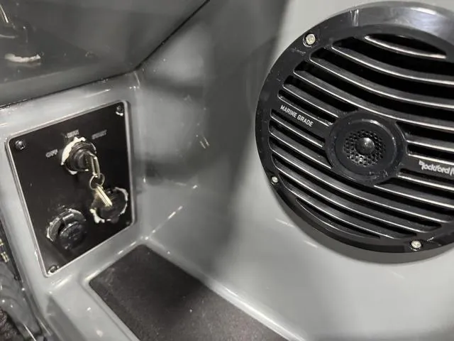 Slide: The Image of Control panel and speaker in 2025 Lund 185 Impact GL Sport boat. - 26