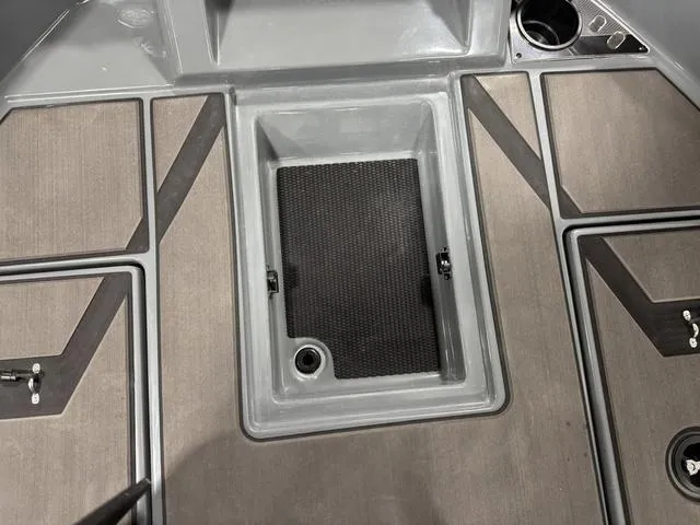 Slide: The Image of 2025 Lund 185 Impact GL Sport boat interior with storage compartments and cup holder. - 30