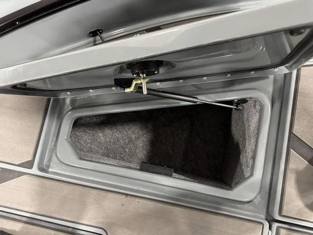 Slide: The Image of Open storage compartment in 2025 Lund 185 Impact GL Sport boat. - 33