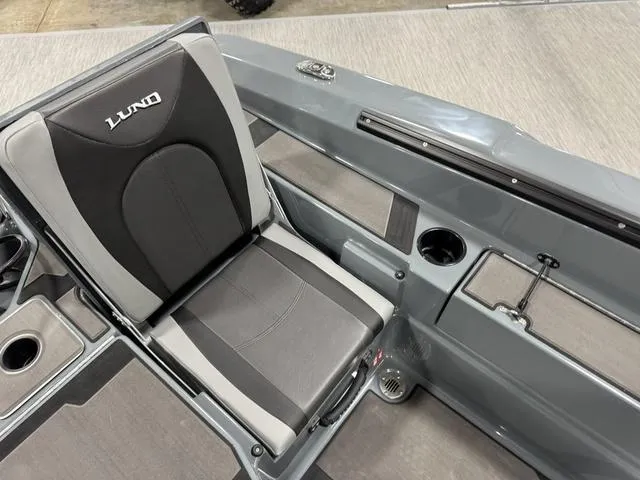 Slide: The Image of 2025 Lund 185 Impact GL Sport boat seat with cup holder and storage. - 6