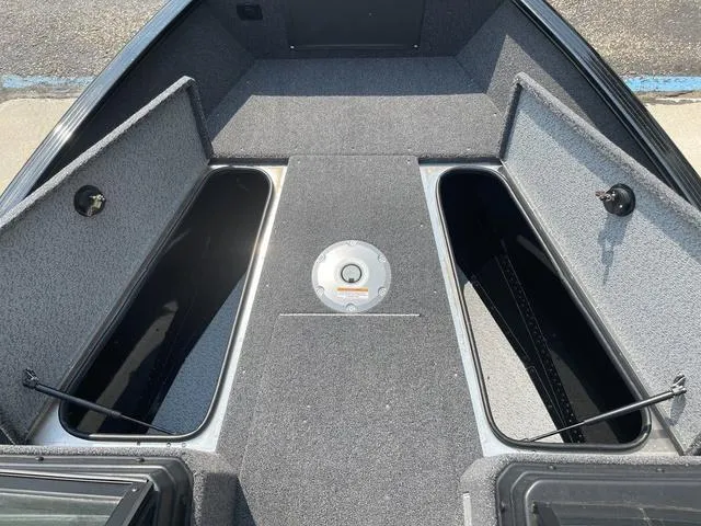 Slide: The Image of 2025 Lund 1775 Adventure Sport boat interior with open storage compartments. - 15