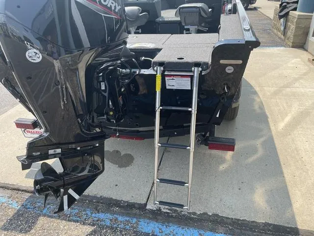 Slide: The Image of 2025 Lund 1775 Adventure Sport boat with ladder and Mercury outboard motor. - 4