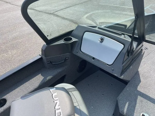 Slide: The Image of 2025 Lund 1775 Adventure Sport boat interior with console and seating. - 7