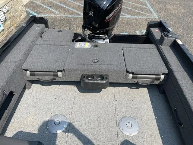 Slide: The Image of 2025 Lund 1775 Adventure Sport boat interior with Mercury engine, featuring spacious seating and storage. - 8