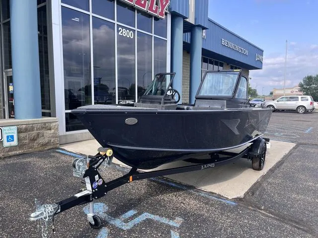 Slide: The Image of 2025 Lund 1775 Adventure Sport boat on trailer outside dealership. - 4