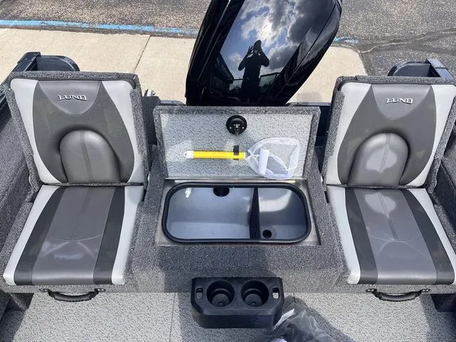 Slide: The Image of 2025 Lund 1775 Adventure Sport boat interior with seating and storage compartments. - 8