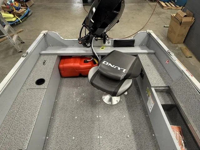 Slide: The Image of 2025 Lund 1600 Fury Tiller boat interior with seat and fuel tank. - 12