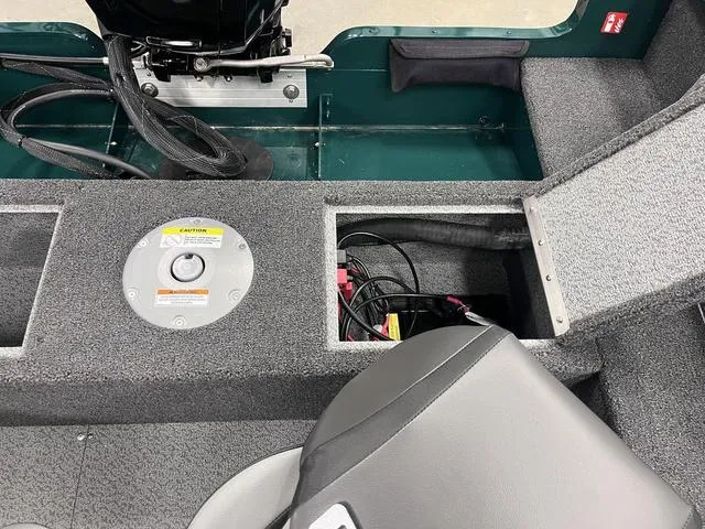 Slide: The Image of 2025 Lund 1650 Rebel XL Sport interior, featuring storage compartments and seating. - 20