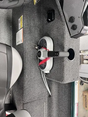 Slide: The Image of 2025 Lund 1650 Rebel XL Sport boat interior with control panel and seating. - 23