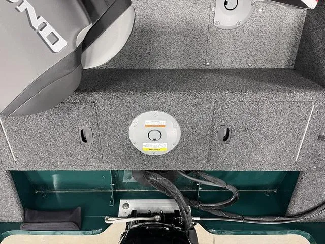 Slide: The Image of 2025 Lund 1650 Rebel XL Sport boat interior with motor and storage compartments. - 26