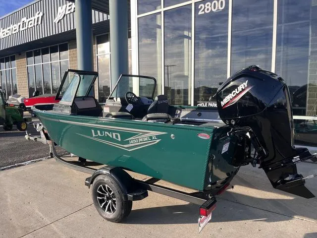 Slide: The Image of 2025 Lund 1650 Rebel XL Sport boat with Mercury engine on trailer. - 3