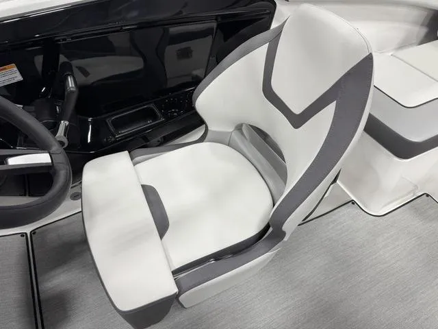 Slide: The Image of 2025 Yamaha Boats AR220 cockpit with modern steering and sleek seating design. - 13