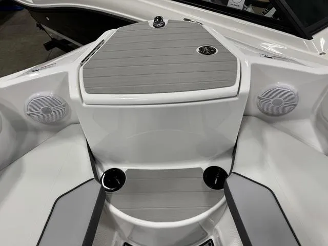 Slide: The Image of 2025 Yamaha Boats AR220 bow area with speakers and cup holders. - 19
