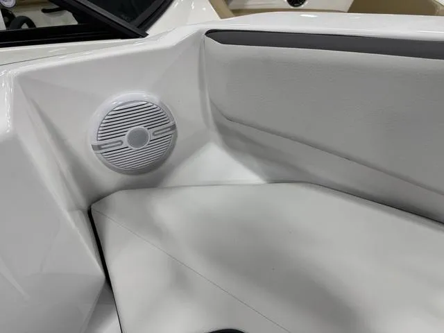Slide: The Image of 2025 Yamaha Boats AR220 interior speaker detail, featuring sleek white design. - 21