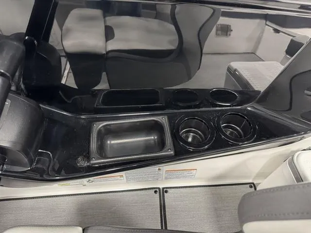 Slide: The Image of Interior view of 2025 Yamaha Boats AR220 with cup holders and seating area. - 7