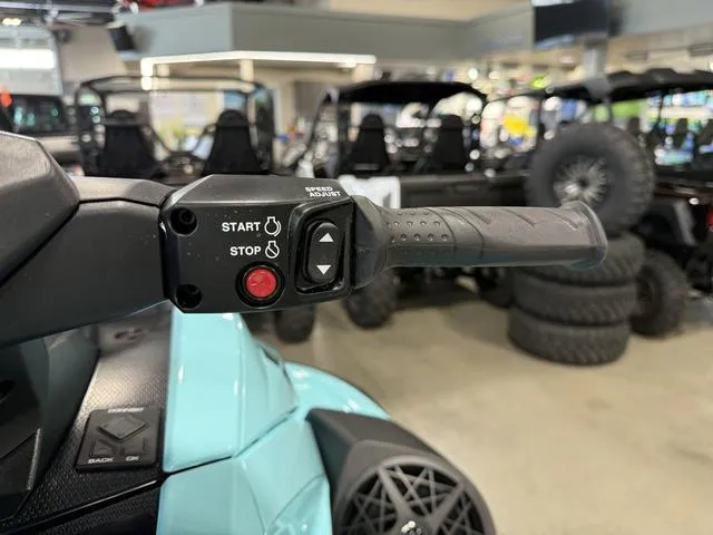 Slide: The Image of 2025 Yamaha Waverunner VX® Limited HO handlebar with start and stop controls in showroom. - 21