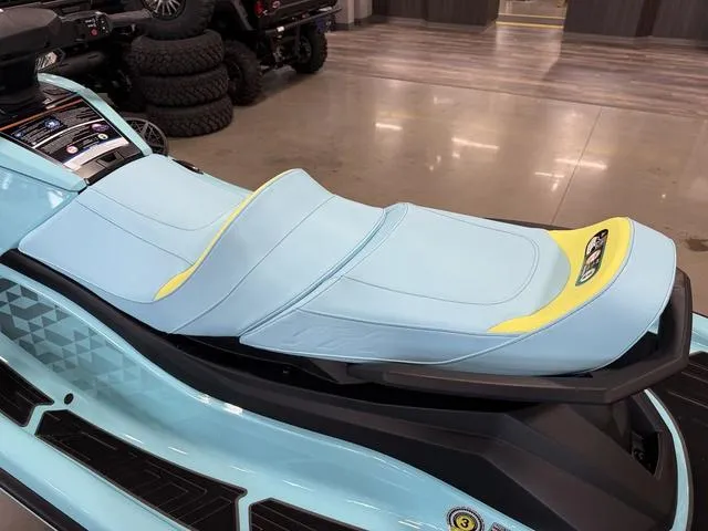 Slide: The Image of 2025 Yamaha Waverunner VX® Limited HO with light blue and yellow seating in showroom. - 9
