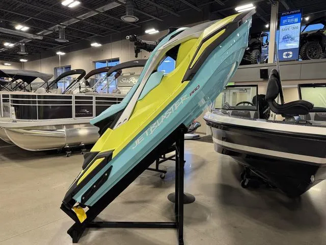 Slide: The Image of 2025 Yamaha Waverunner Jetblaster displayed in a showroom, showcasing sleek design and vibrant colors. - 1