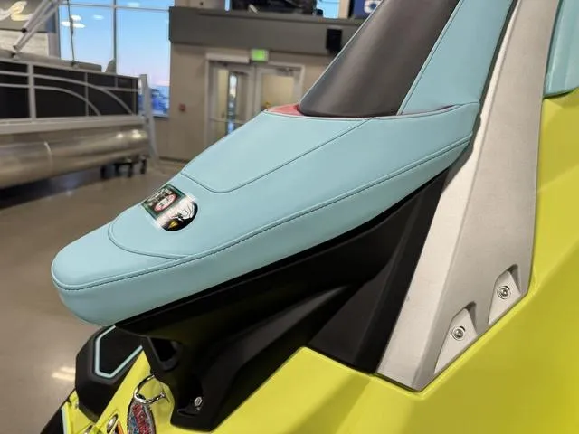 Slide: The Image of 2025 Yamaha Waverunner Jetblaster seat in showroom, featuring sleek design and vibrant colors. - 4