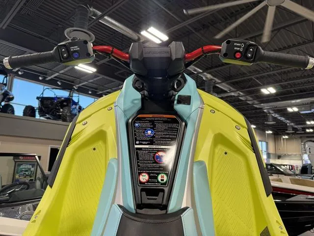 Slide: The Image of 2025 Yamaha Waverunner Jetblaster handlebars in showroom, featuring vibrant design and controls. - 5