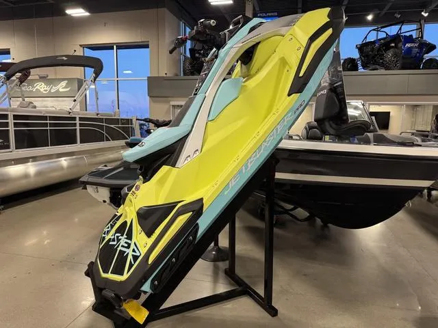Slide: The Image of 2025 Yamaha Waverunners Jetblaster in showroom, vibrant yellow and blue design. - 9