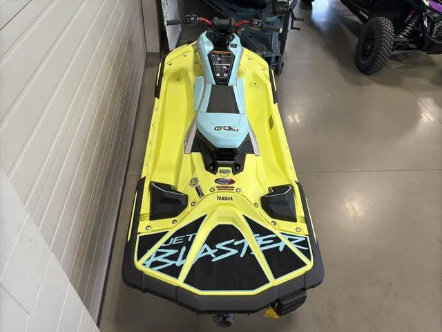 Slide: The Image of 2025 Yamaha Waverunner Jetblaster in vibrant yellow and blue, displayed indoors. - 3