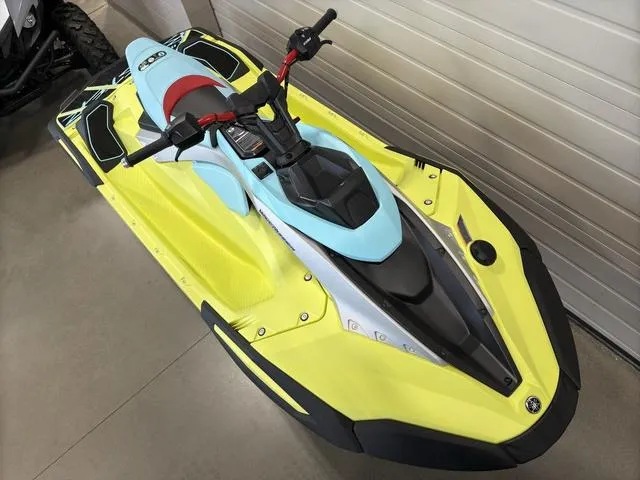Slide: The Image of 2025 Yamaha Waverunners Jetblaster in vibrant yellow and blue, parked indoors. - 34